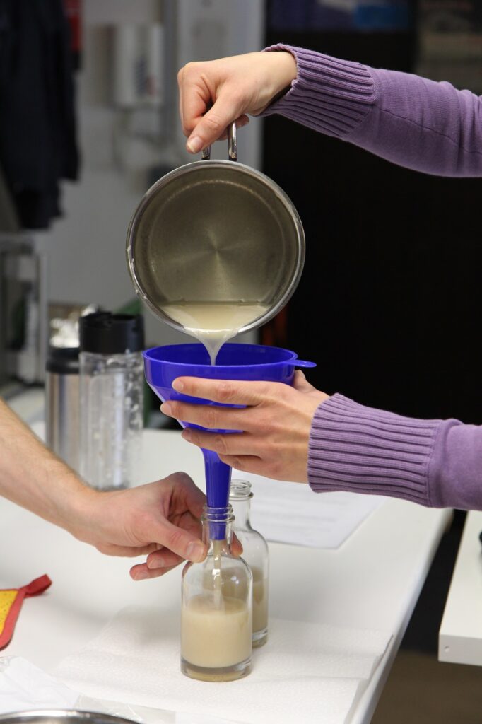 A hand holding a glass of wine