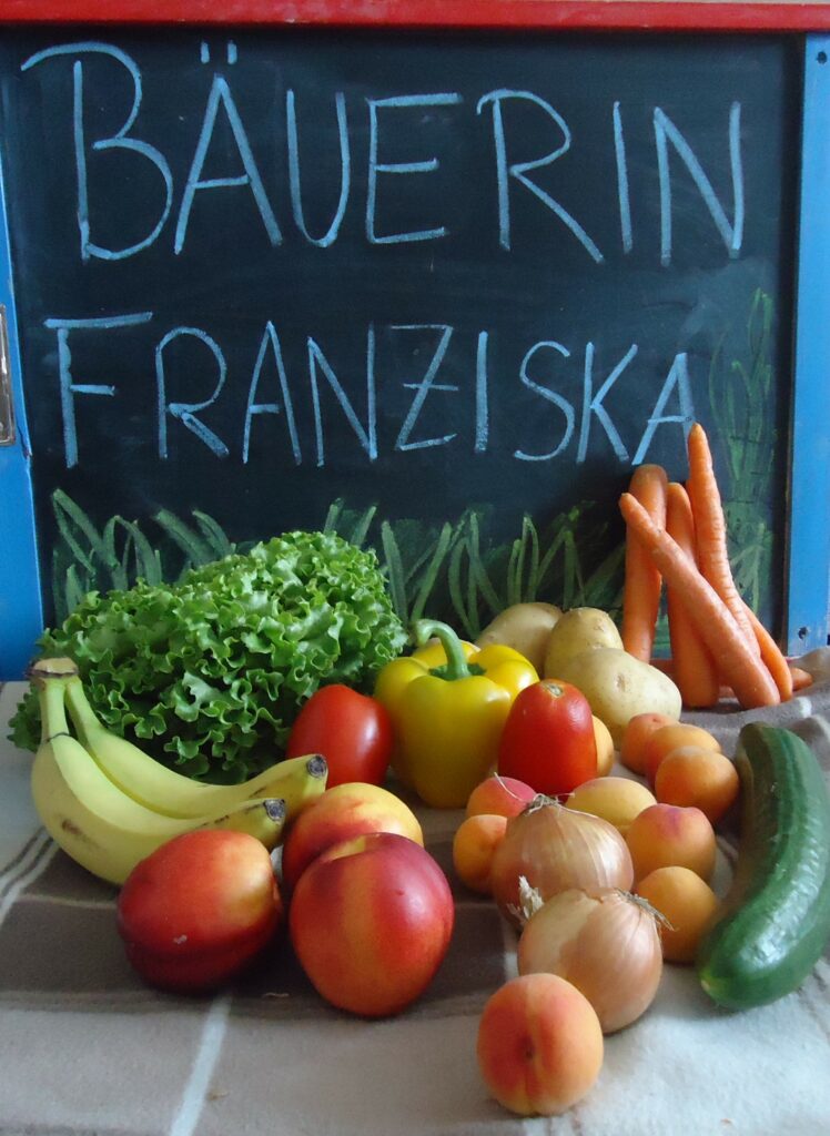 A bowl of fruit and vegetable stand