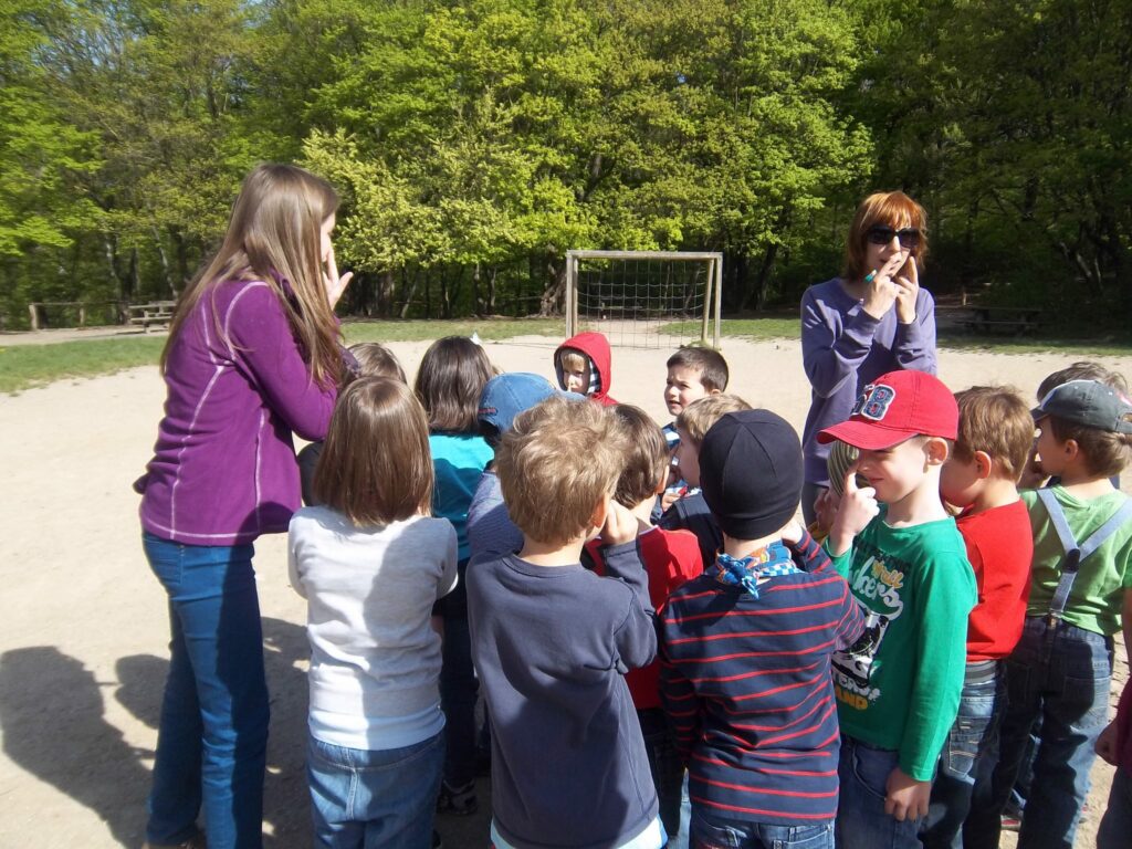 A group of people standing next to a child